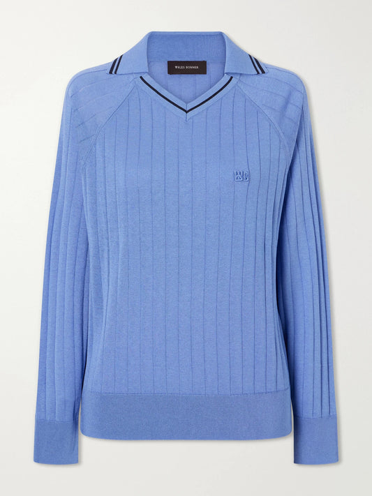 Image of a model wearing Outerwear. Product name - Roots Logo-embroidered Striped Polo Shirt in Blue colour by brand - Wales Bonner