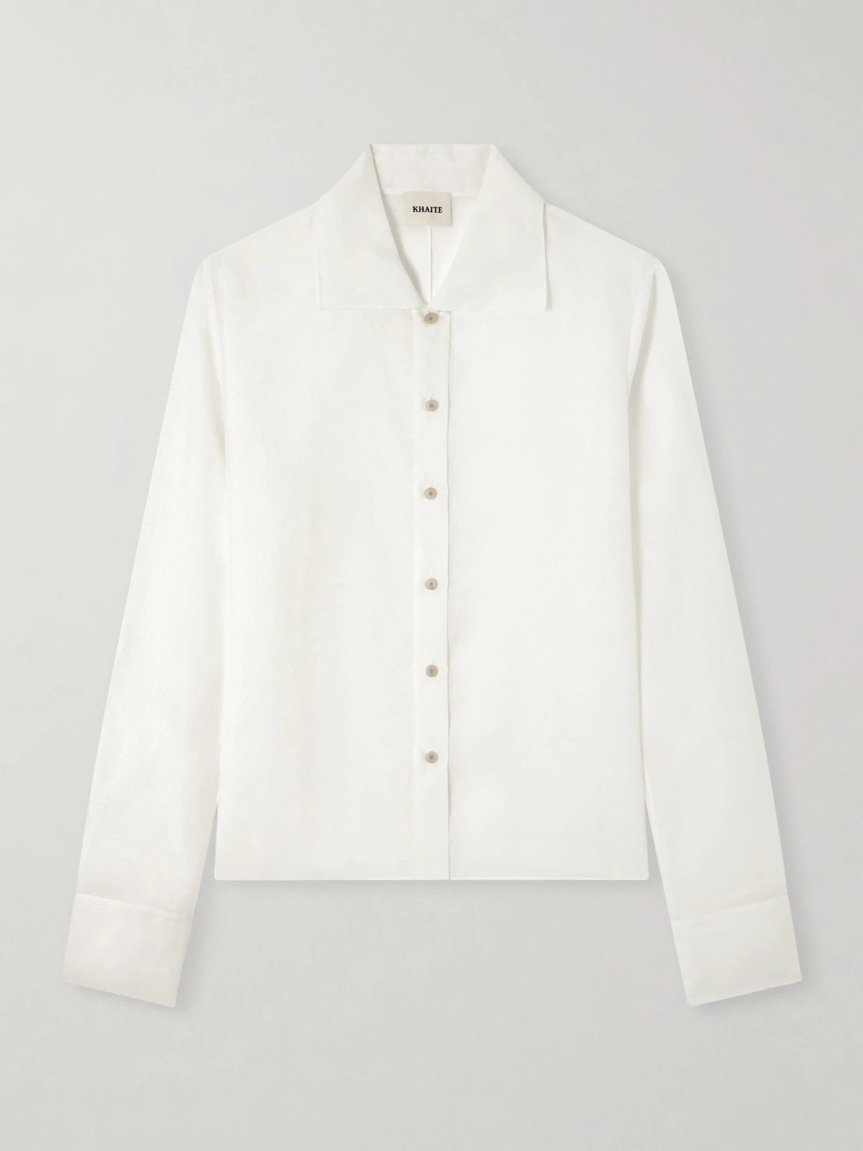 Image of a model wearing Tops. Product name - Jaylin Cotton And Silk-blend Shirt in Off-white colour by brand - KHAITE