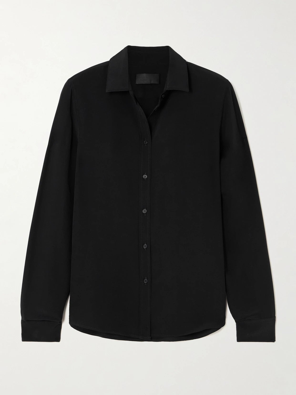 Image of a model wearing Tops. Product name - Gaia Silk Crepe De Chine Shirt in Black colour by brand - Nili Lotan