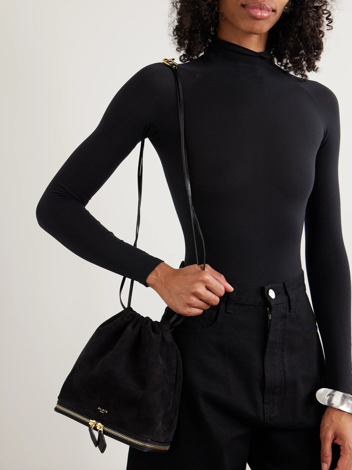 Image of Bags. Product name - Le Pochon Leather-trimmed Suede Shoulder Bag in Black colour by brand - Alaïa