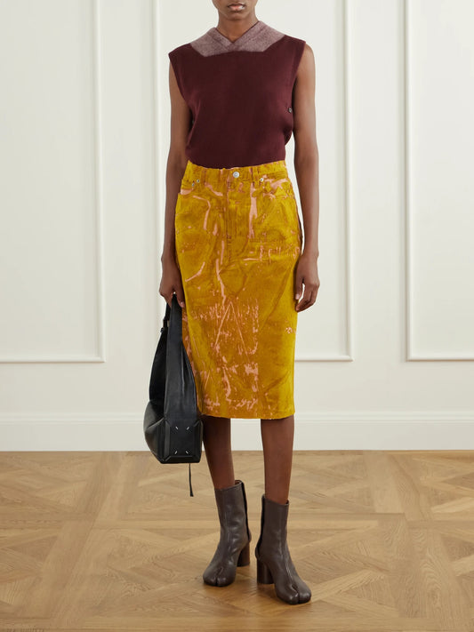 Image of a model wearing Skirts. Product name - Flocked Denim Midi Skirt in Orange colour by brand - Maison Margiela