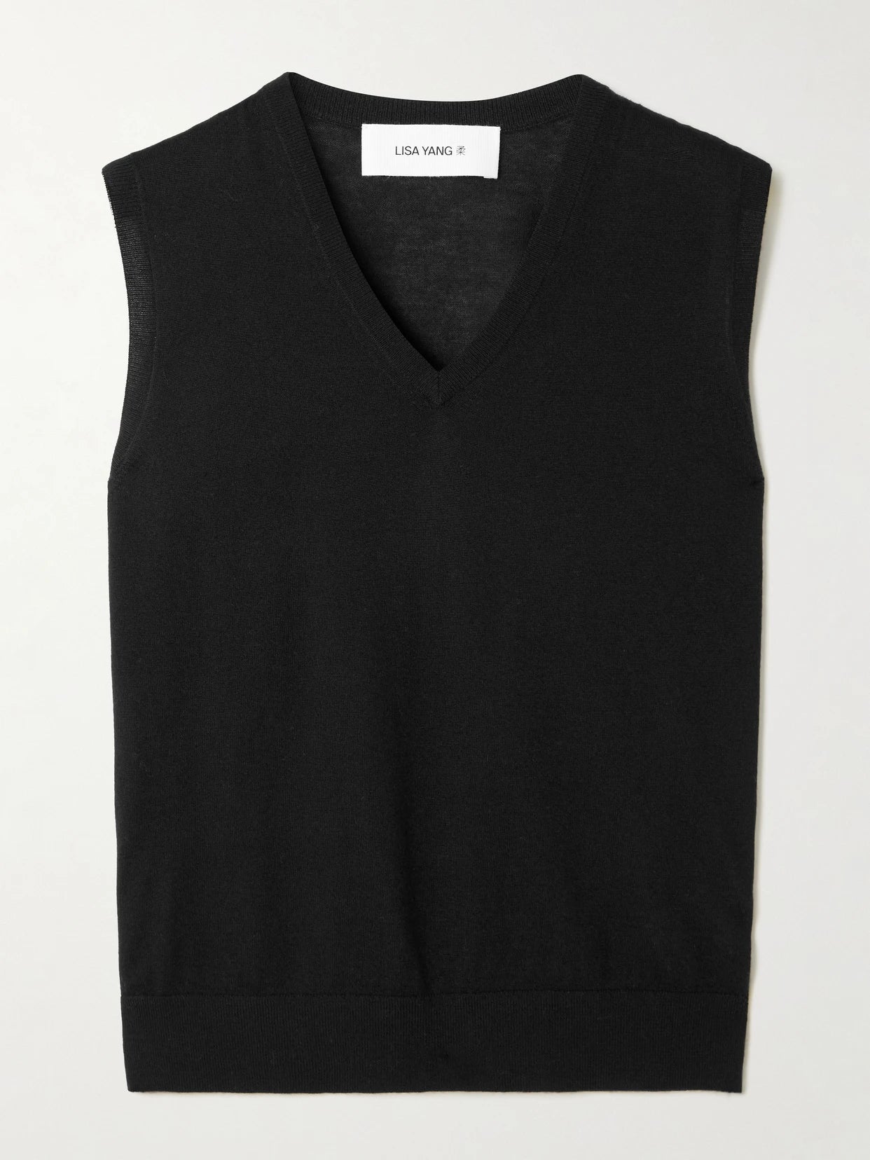 Image of a model wearing Outerwear. Product name - Lauri Cashmere Vest in Black colour by brand - LISA YANG