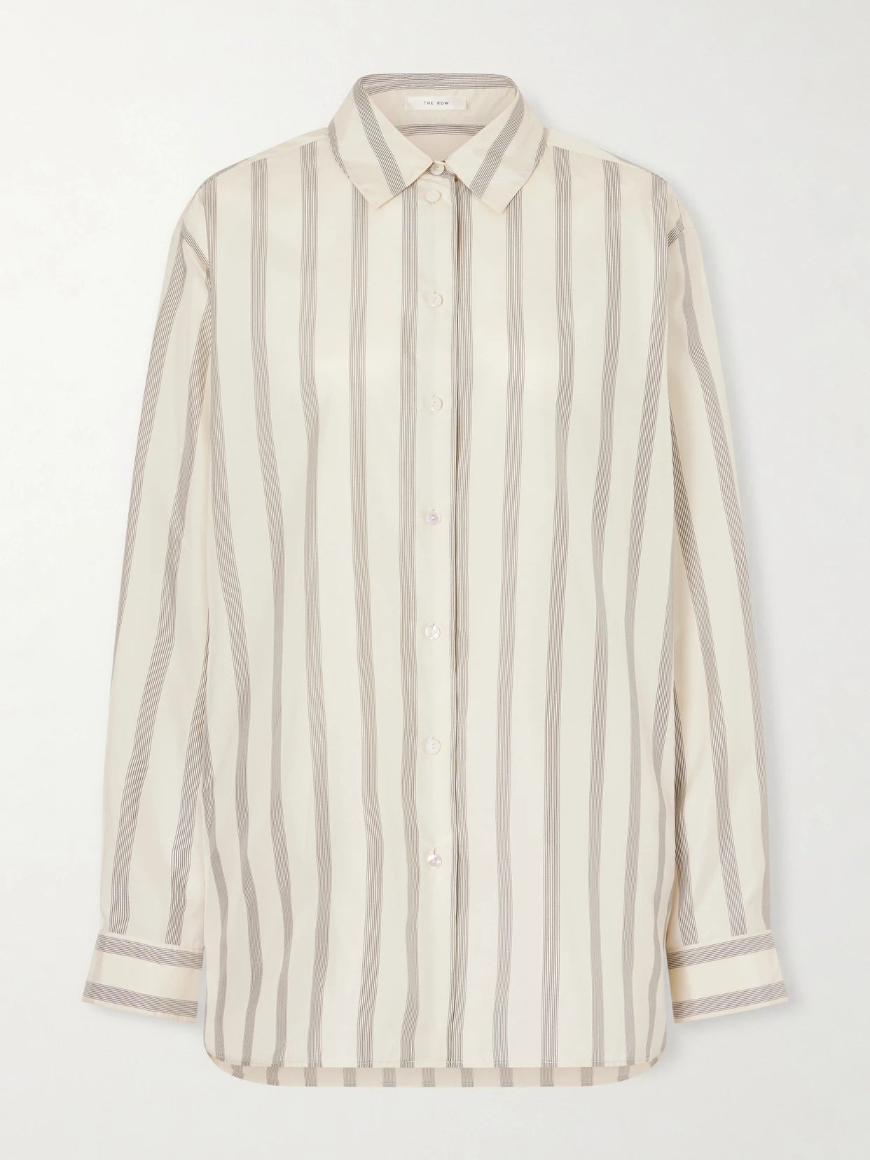 Image of a model wearing Tops. Product name - Sisilia Oversized Pinstriped Silk-twill Shirt in Beige colour by brand - The Row