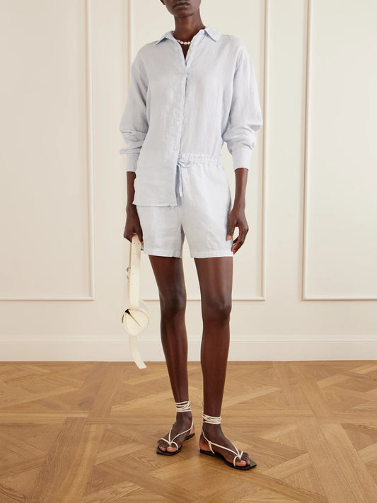 Image of a model wearing Shorts. Product name - Linen Shorts in Blue colour by brand - James Perse
