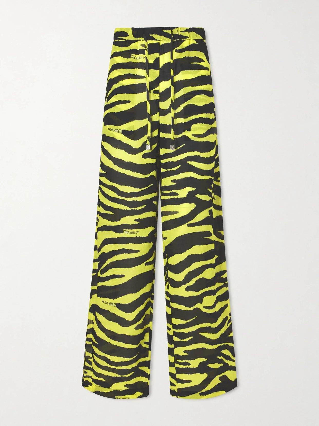 Image of a model wearing Pants. Product name - Zebra-print Cotton Mid-rise Wide-leg Pants in Yellow colour by brand - The Attico