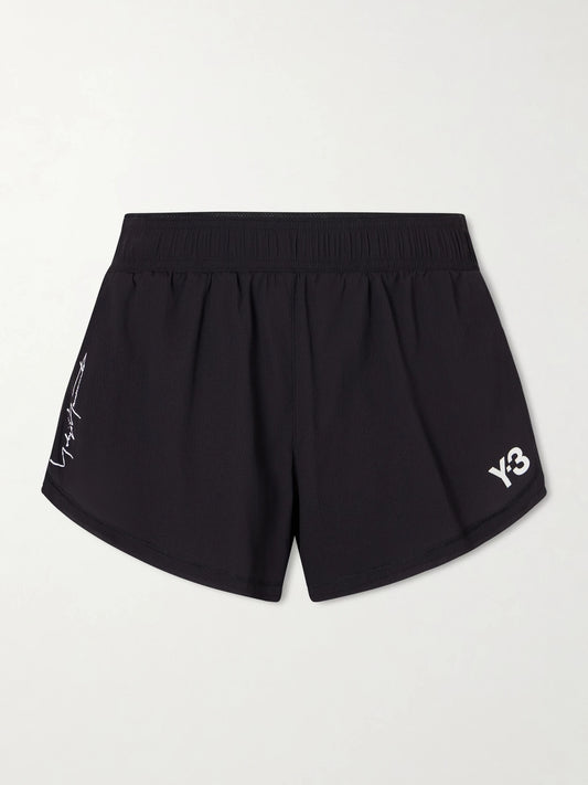 Image of a model wearing Shorts. Product name - + Y-3 Printed Crinkled-shell Shorts in Black colour by brand - adidas Originals