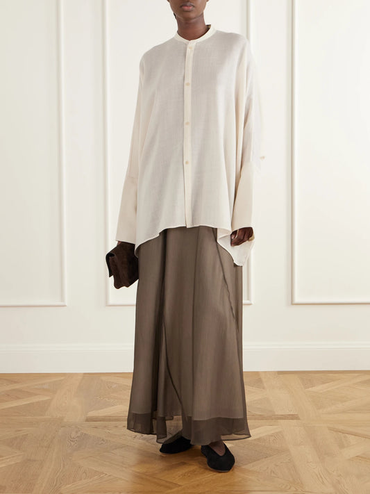 Image of a model wearing Skirts. Product name - Layered Paneled Silk-crepe De Chine Maxi Skirt in Army green colour by brand - Ruohan