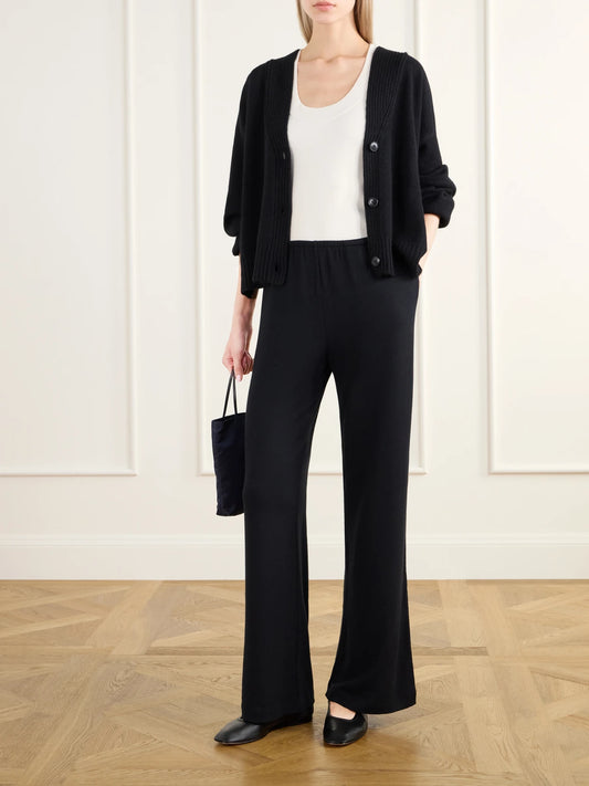 Image of a model wearing Pants. Product name - Lauren Jersey Straight-leg Pants in Black colour by brand - LESET