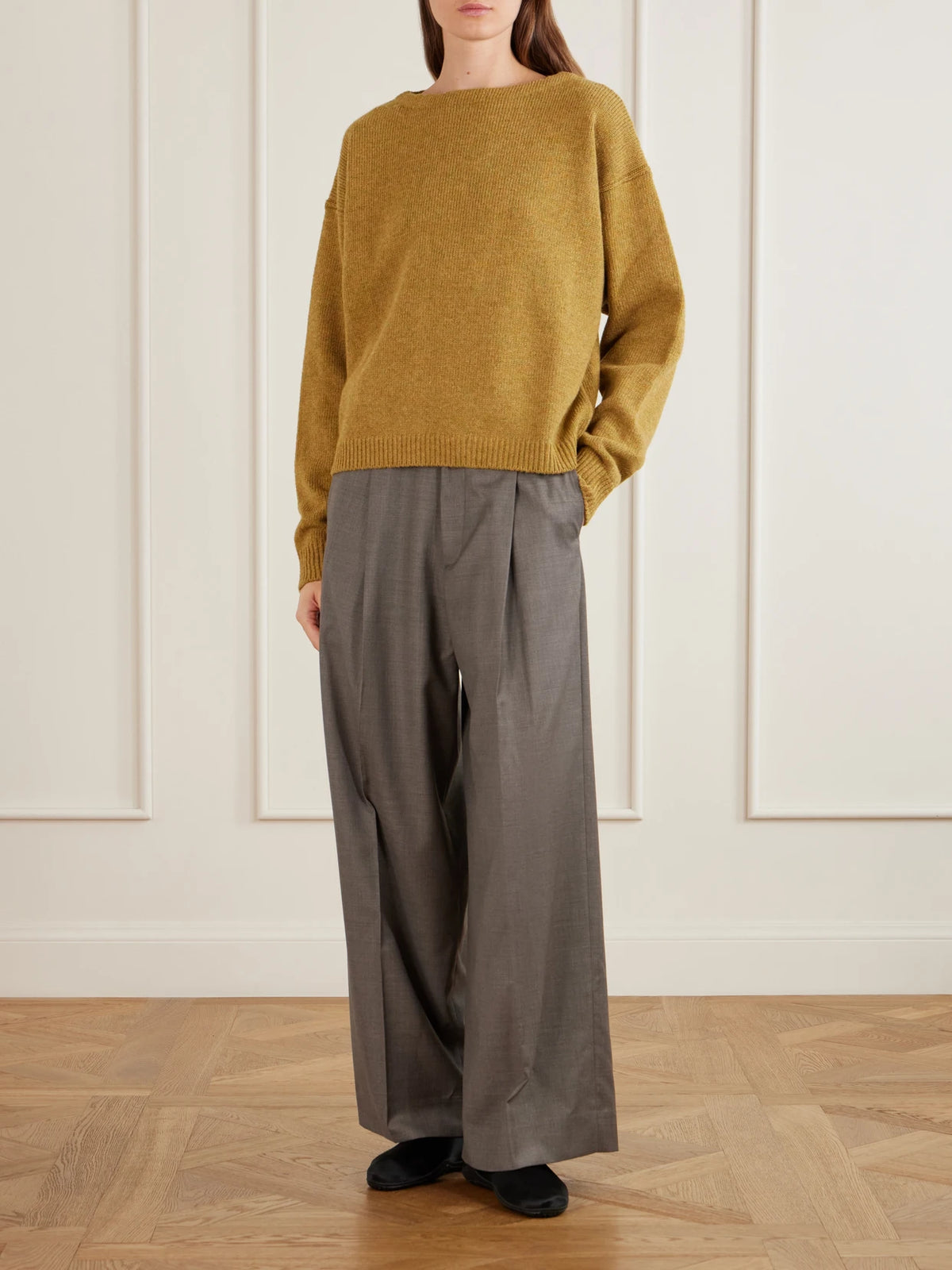 Image of a model wearing Outerwear. Product name - Wool Sweater in Yellow colour by brand - RIER