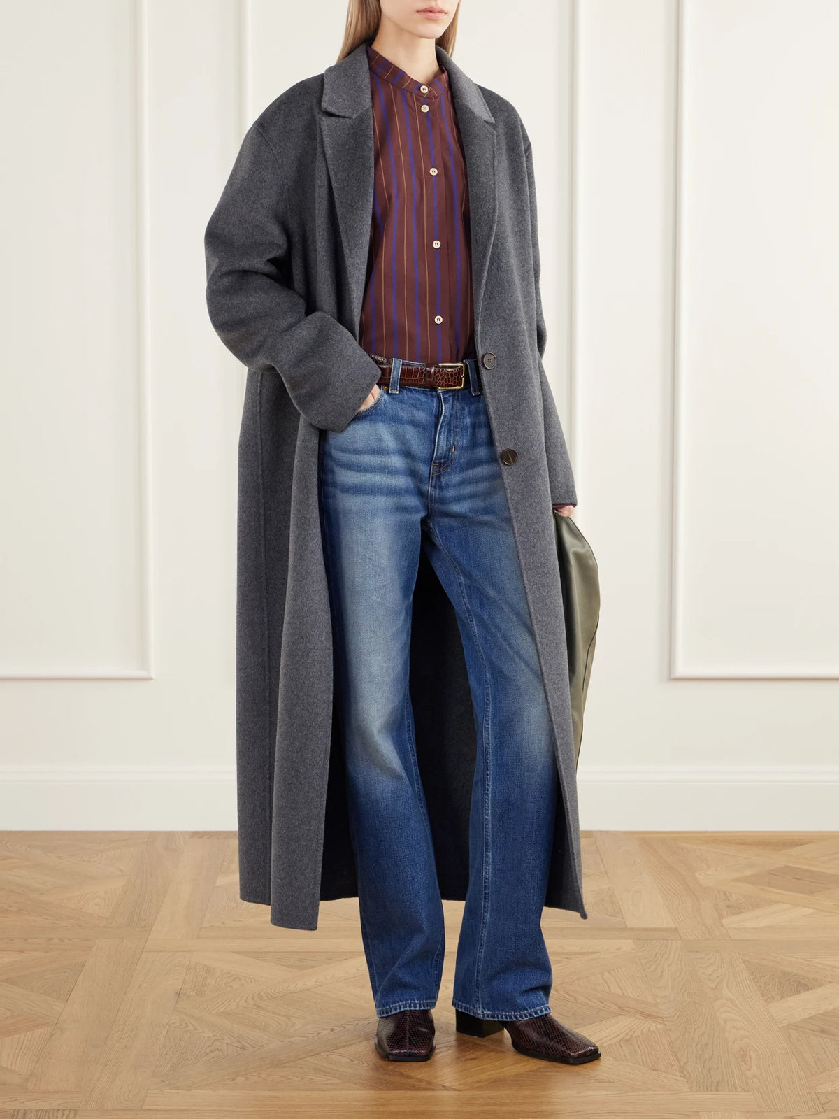 Image of a model wearing Tops. Product name - The Editor Striped Cotton And Silk-blend Poplin Shirt in Burgundy colour by brand - Jamie Haller