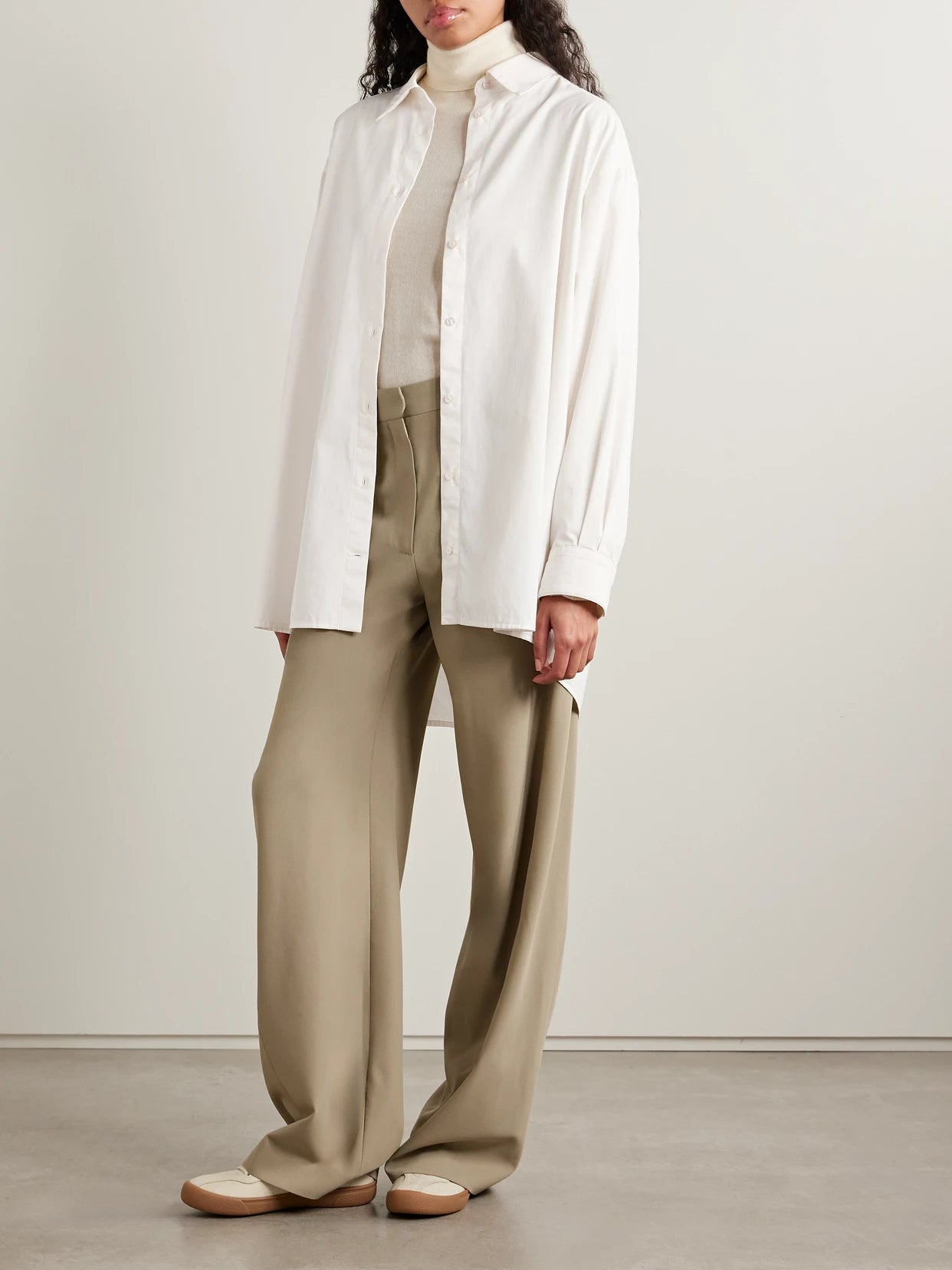 Image of a model wearing Tops. Product name - Luka Oversized Cotton And Cashmere-blend Twill Shirt in White colour by brand - The Row