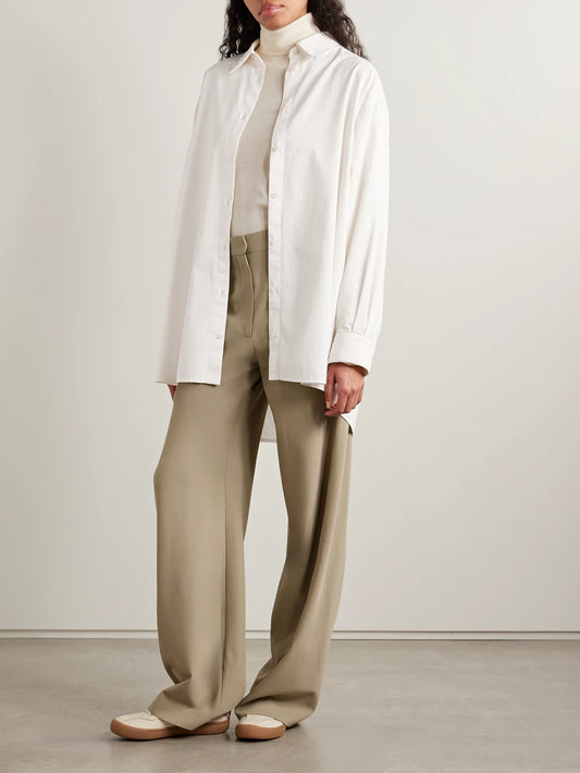 Image of a model wearing Tops. Product name - Luka Oversized Cotton And Cashmere-blend Twill Shirt in White colour by brand - The Row