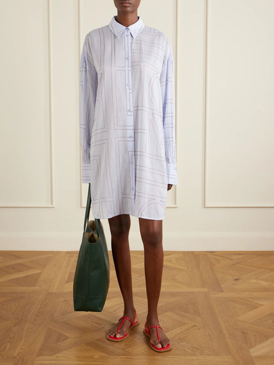Image of a model wearing Tops. Product name - Embroidered Lyocell And Cotton-blend Shirt in Blue colour by brand - TOTEME