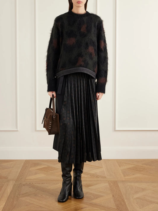 Image of a model wearing Skirts. Product name - Pleated Leopard-print Jersey And Satin Midi Skirt in Black colour by brand - Sacai