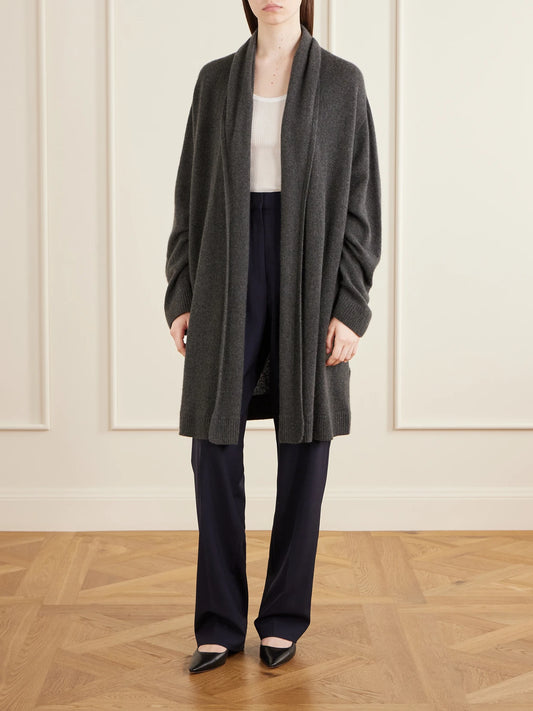 Image of a model wearing Outerwear. Product name - Ovaan Cashmere Cardigan in Anthracite colour by brand - The Row