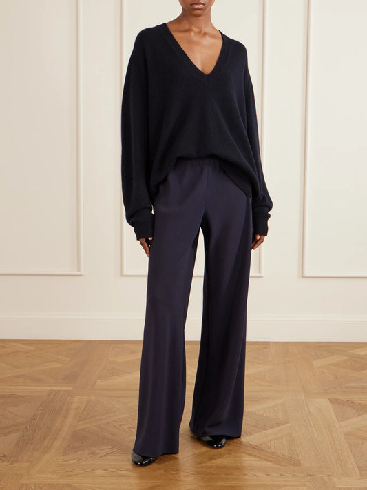 Image of a model wearing Outerwear. Product name - Feron Cashmere Sweater in Navy, Burgundy colour by brand - Nili Lotan