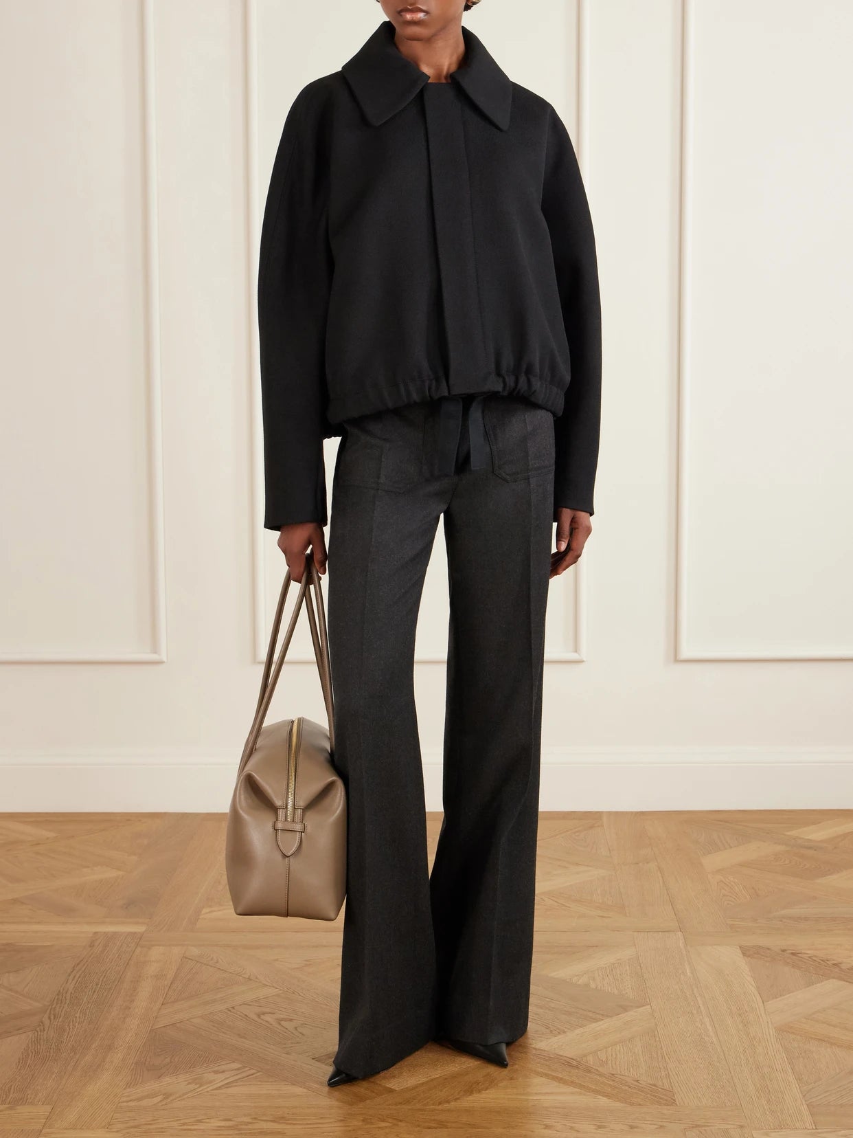 Image of a model wearing Pants. Product name - Alina Wide-leg Wool Pants in Dark gray colour by brand - Victoria Beckham