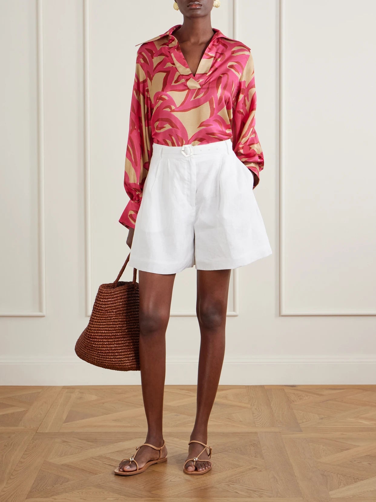 Image of a model wearing Tops. Product name - Ismene Printed Silk-blend Satin Blouse in Pink colour by brand - Themis Z