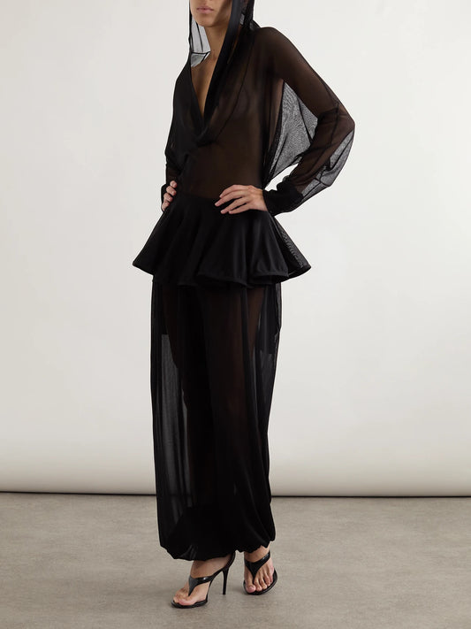 Image of a model wearing Tops. Product name - Hooded Jersey Bodysuit in Black colour by brand - Alaïa