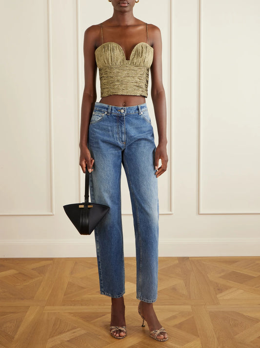 Image of a model wearing Tops. Product name - Vina Cropped Metallic Taffeta Tank in Gold colour by brand - Ulla Johnson