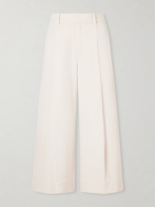 Image of a model wearing Pants. Product name - Cotton-blend Wide-leg Pants in Cream colour by brand - Brunello Cucinelli
