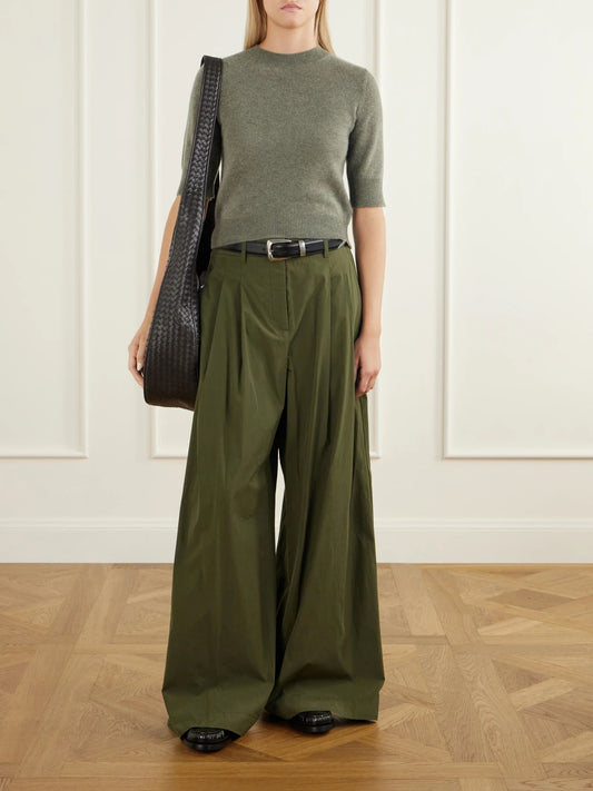 Image of a model wearing Outerwear. Product name - Chypre Cropped Organic Cashmere Sweater in Green, Black colour by brand - Le Kasha