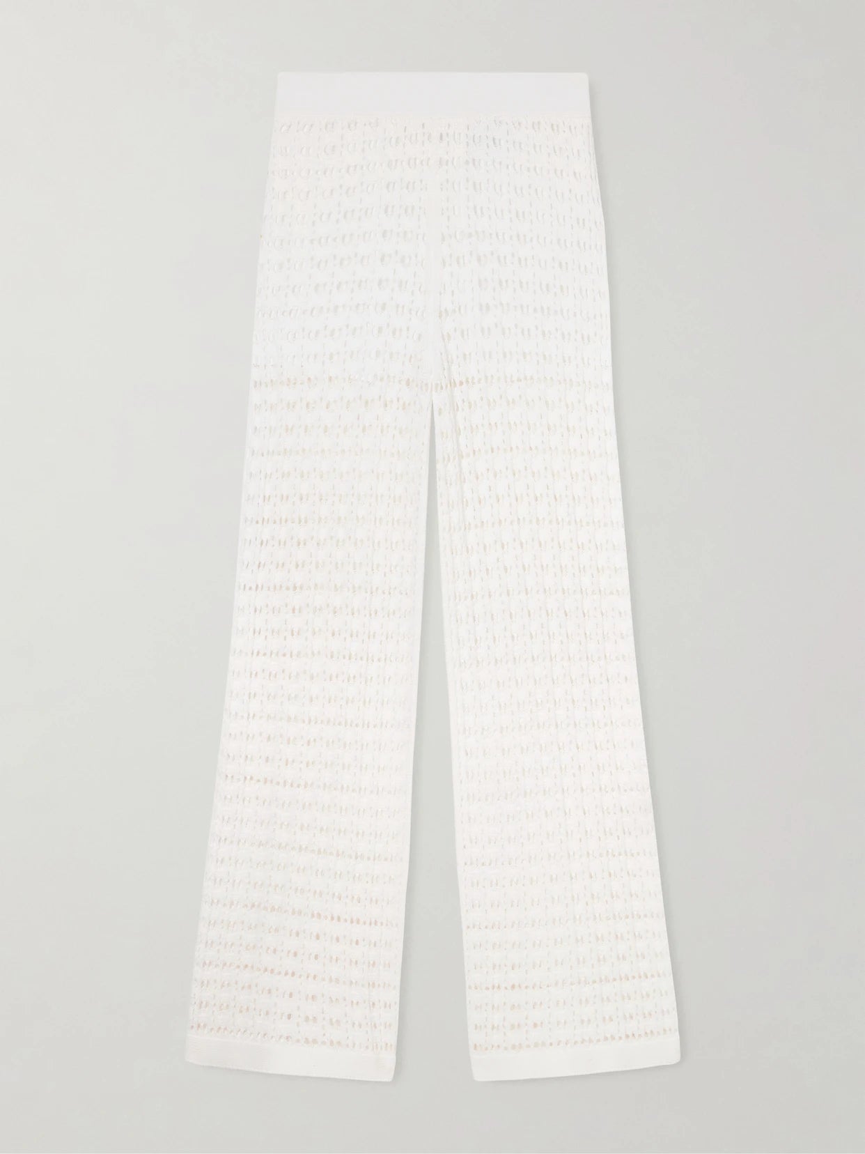 Image of a model wearing Pants. Product name - Ray Crocheted Cotton Straight-leg Pants in White colour by brand - Arch4