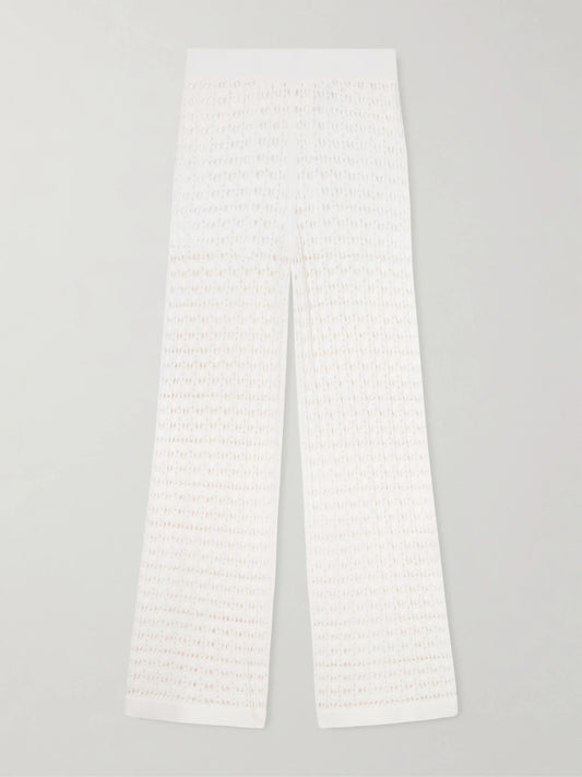 Image of a model wearing Pants. Product name - Ray Crocheted Cotton Straight-leg Pants in White colour by brand - Arch4