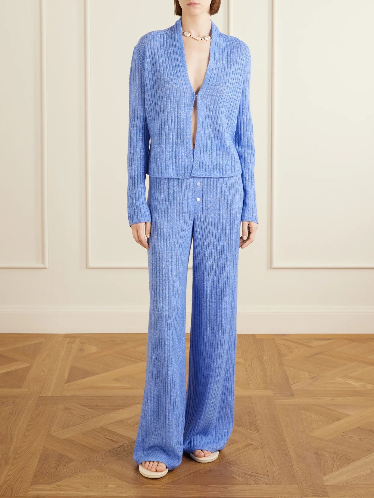Image of a model wearing Outerwear. Product name - Stealth Ribbed Cashmere And Linen-blend Cardigan in Blue colour by brand - Guest In Residence