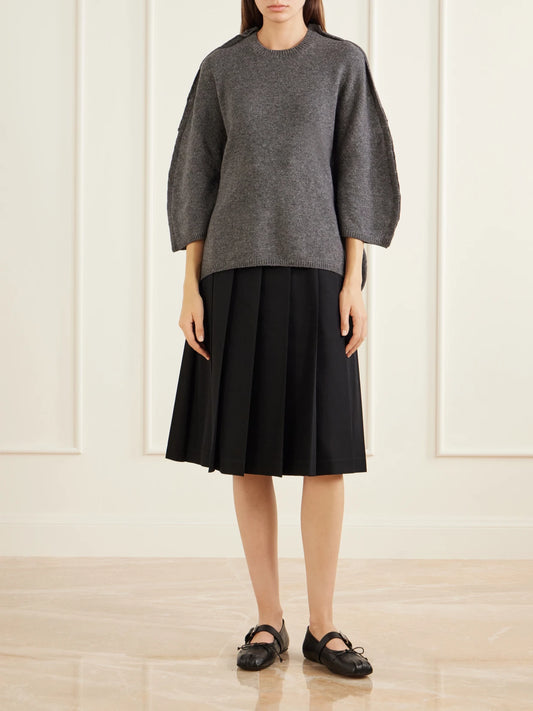 Image of a model wearing Outerwear. Product name - Peplum Wool Sweater in Gray colour by brand - Comme des Garçons Comme des Garçons