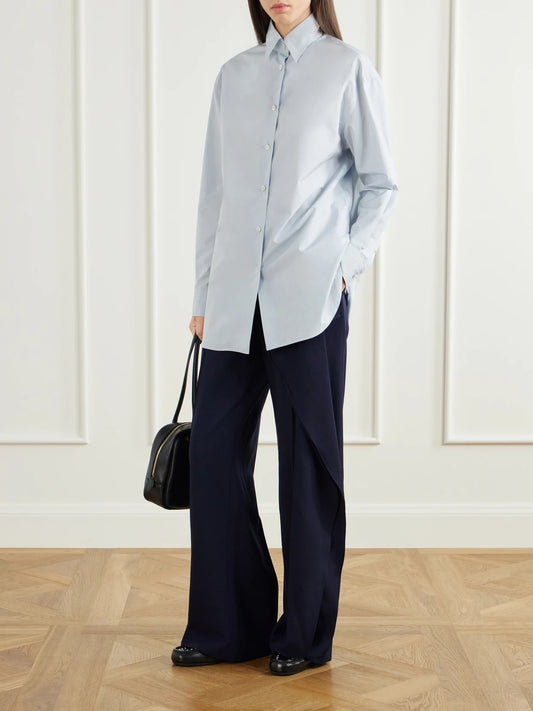 Image of a model wearing Pants. Product name - Draped Wool-sablé Wide-leg Pants in Navy, Black colour by brand - Jil Sander