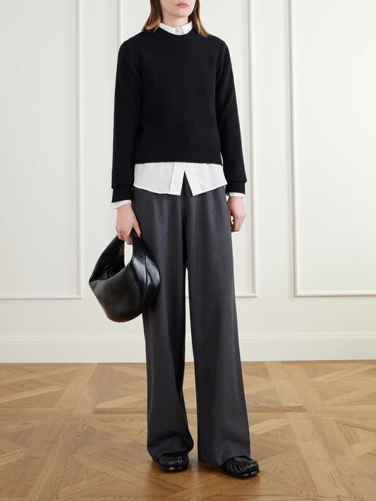 Image of a model wearing Pants. Product name - Wool-blend Flannel Wide-leg Pants in Charcoal colour by brand - Maria McManus