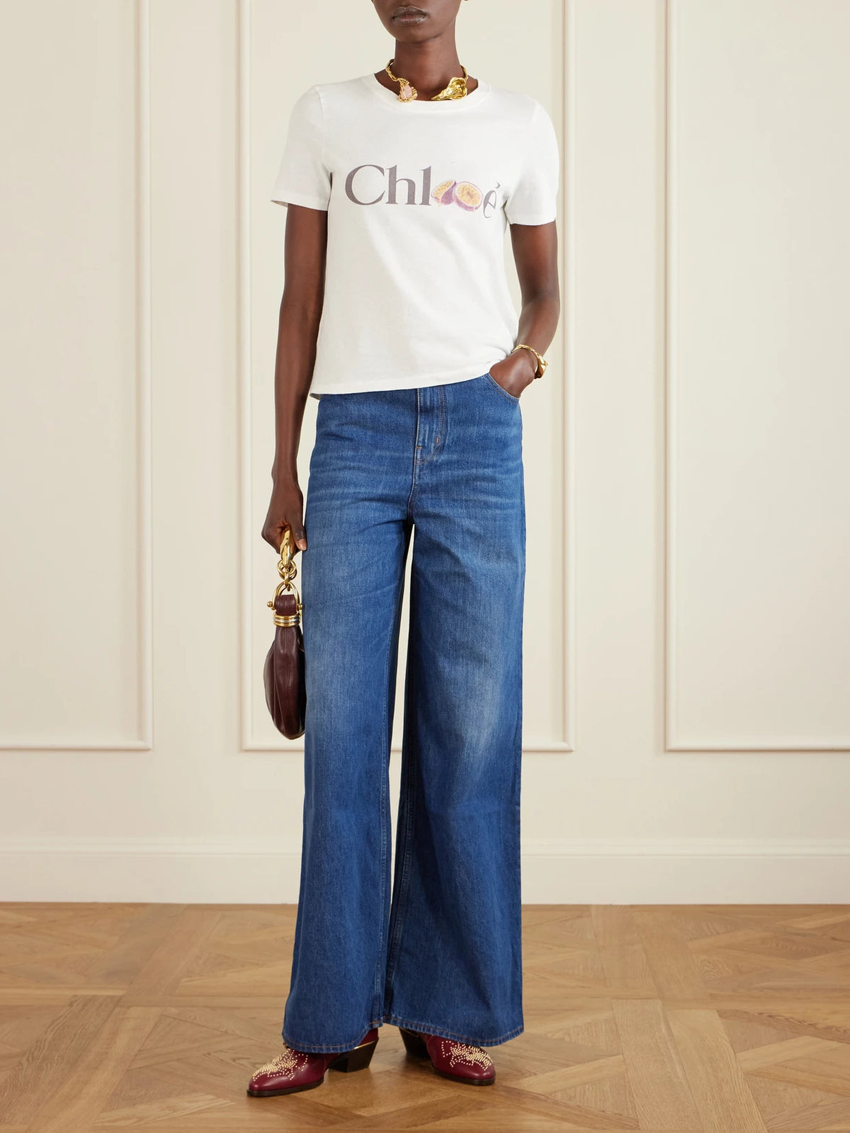 Image of a model wearing Tops. Product name - Printed Organic Cotton-jersey T-shirt in White colour by brand - Chloé