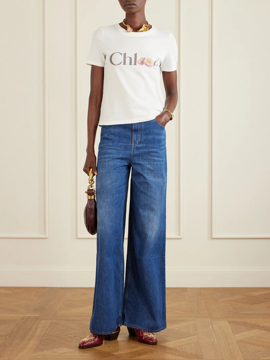 Image of a model wearing Tops. Product name - Printed Organic Cotton-jersey T-shirt in White colour by brand - Chloé