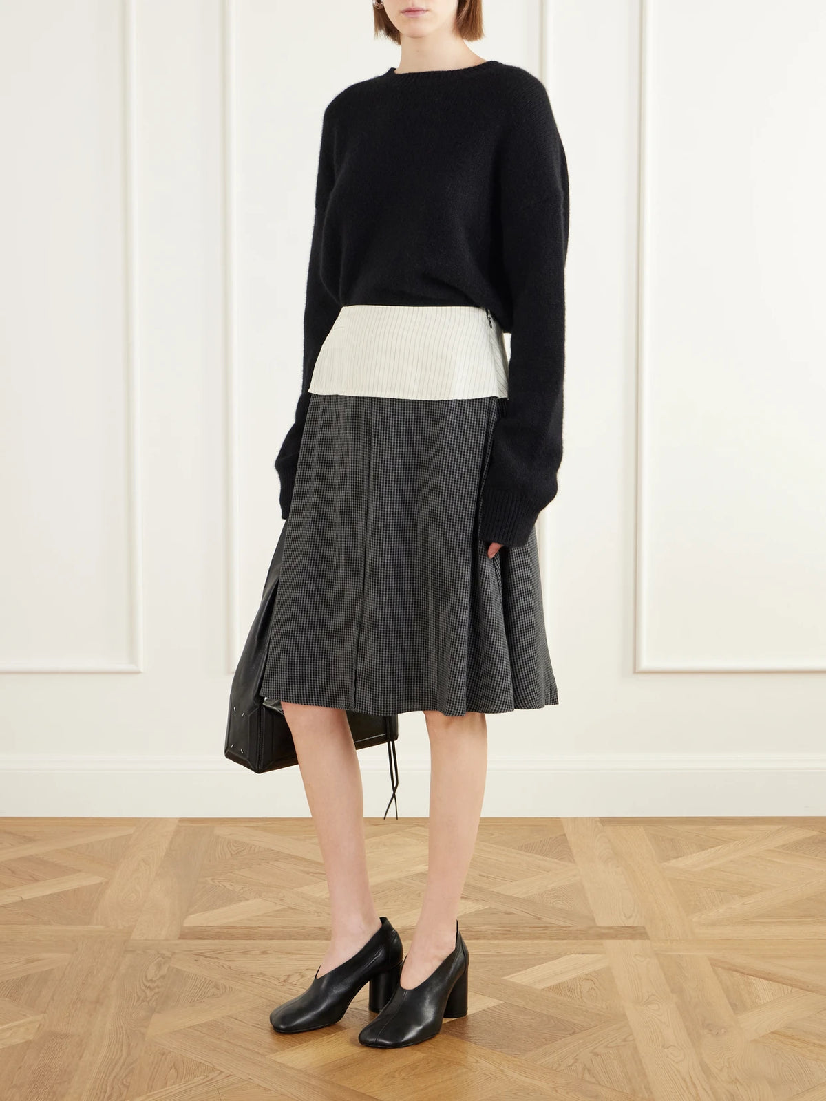 Image of a model wearing Skirts. Product name - Committee Pinstriped Checked Seersucker Midi Skirt in Dark gray colour by brand - MFPEN