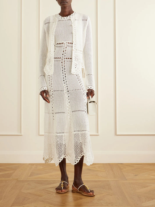 Image of a model wearing Outerwear. Product name - Crocheted Cotton Peplum Cardigan in White colour by brand - Erdem