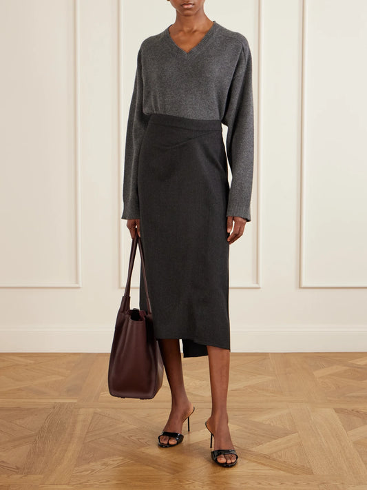 Image of a model wearing Skirts. Product name - Wool Pleated Midi Skirt in Dark gray colour by brand - Victoria Beckham