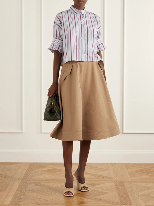 Image of a model wearing Tops. Product name - Next Ex Cropped Striped Cotton-poplin Shirt in Blue colour by brand - TWP