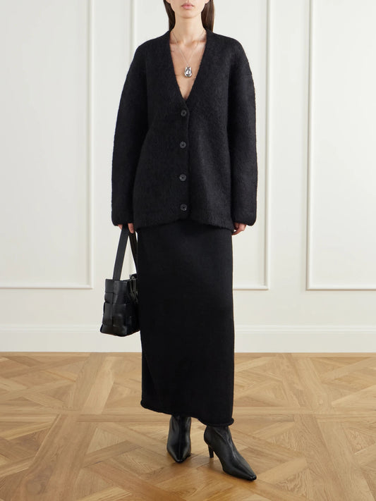 Image of a model wearing Outerwear. Product name - Brushed Alpaca, Pima Cotton And Merino Wool-blend Cardigan in Black colour by brand - Lauren Manoogian