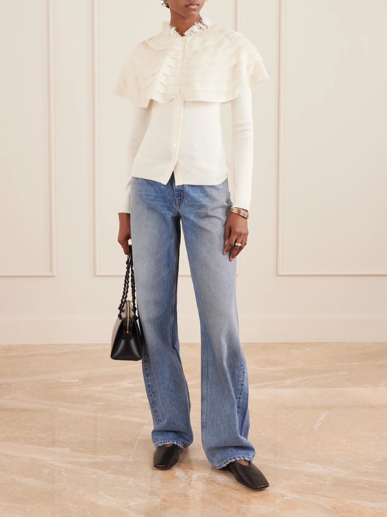 Image of a model wearing Outerwear. Product name - Wanda Ruffled Lace And Brocade-trimmed Wool Cardigan in Cream colour by brand - Sea