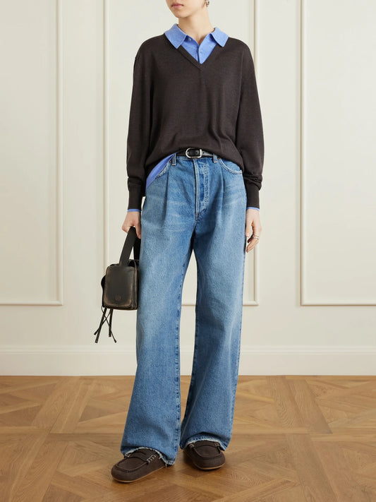 Image of a model wearing Outerwear. Product name - Layered Wool Polo Sweater in Brown colour by brand - Acne Studios