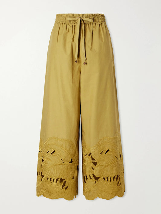 Image of a model wearing Pants. Product name - Mahon Embroidered Cotton Wide-leg Pants in Green colour by brand - Zimmermann