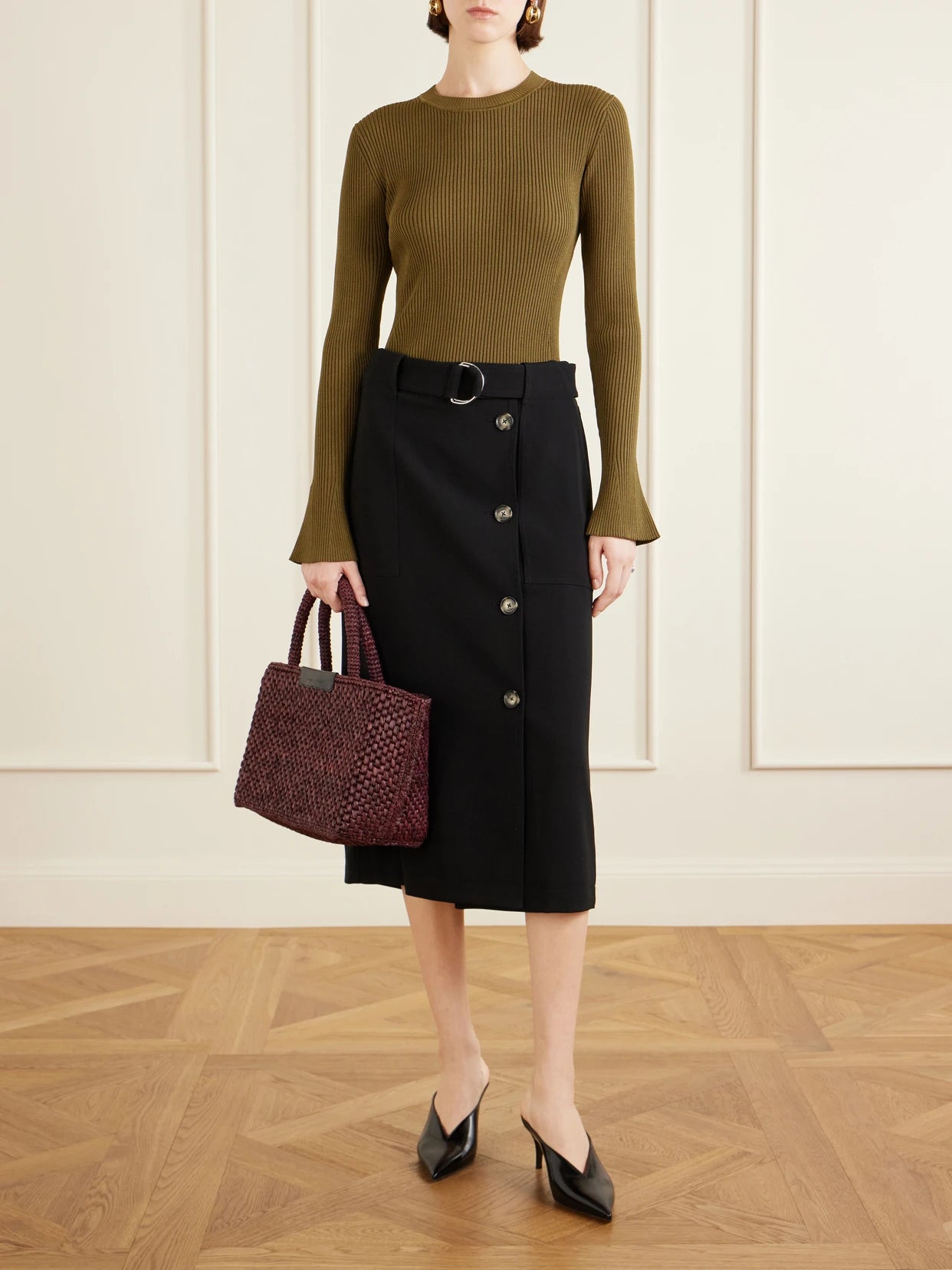 Image of a model wearing Skirts. Product name - Carine Belted Crepe De Chine Midi Skirt in Black colour by brand - Proenza Schouler