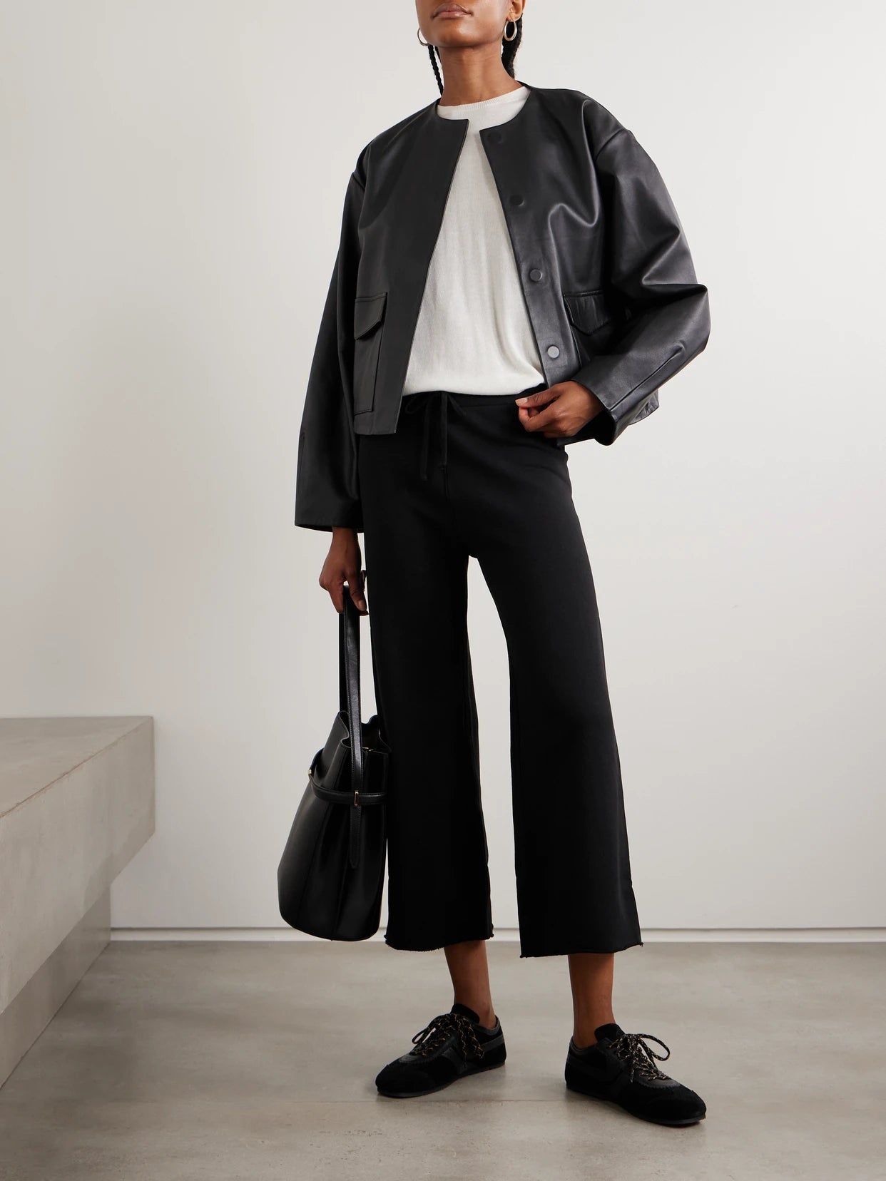 Image of Sleepwear & Loungewear. Product name - Kiki Cropped Voile-trimmed Cotton-jersey Track Pants in Black colour by brand - Nili Lotan
