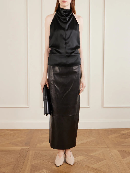 Image of a model wearing Tops. Product name - Rone Satin Halterneck Blouse in Black colour by brand - KHAITE