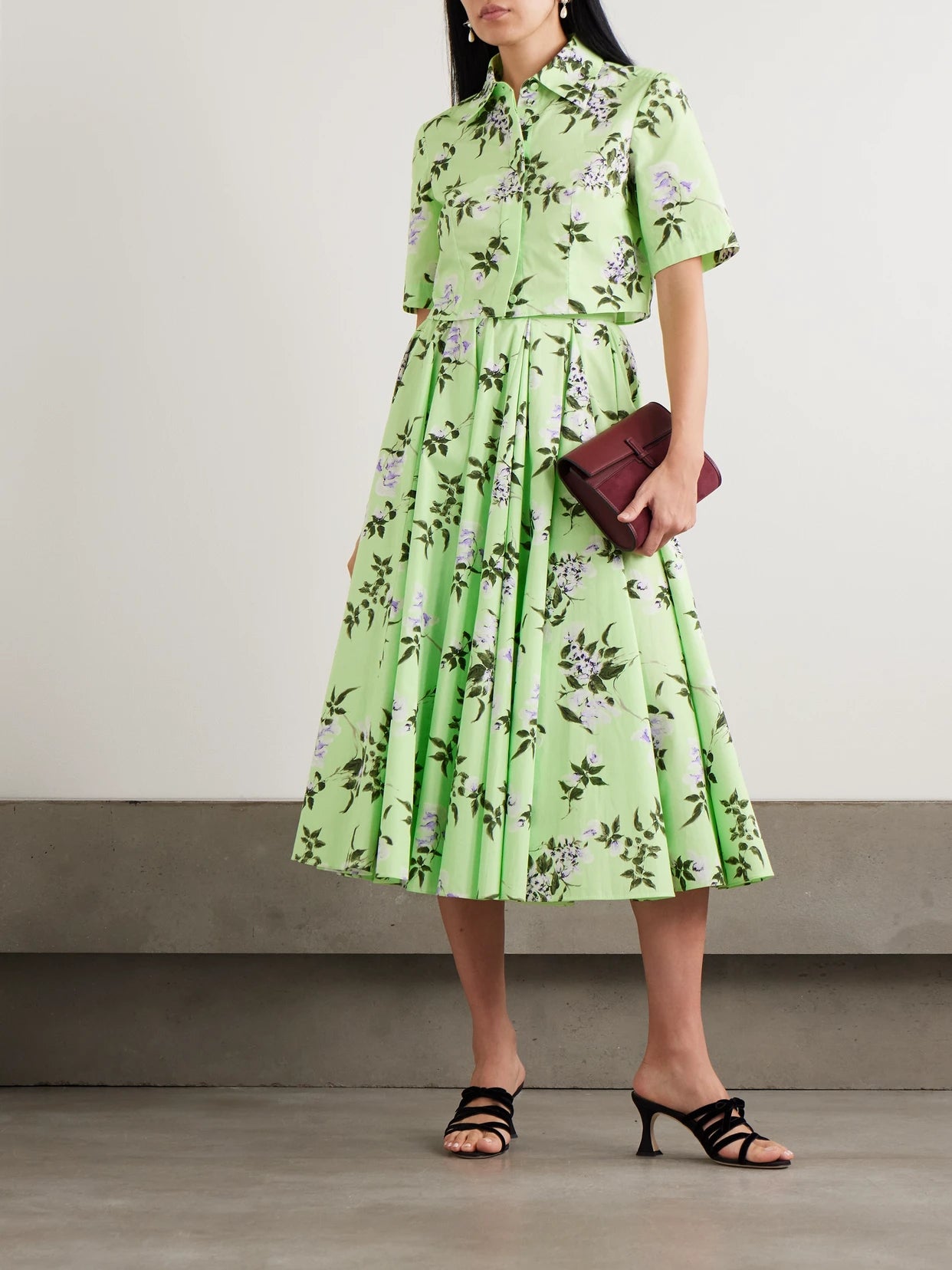 Image of a model wearing Tops. Product name - Natalie Cropped Floral-print Cotton-poplin Shirt in Green colour by brand - Emilia Wickstead