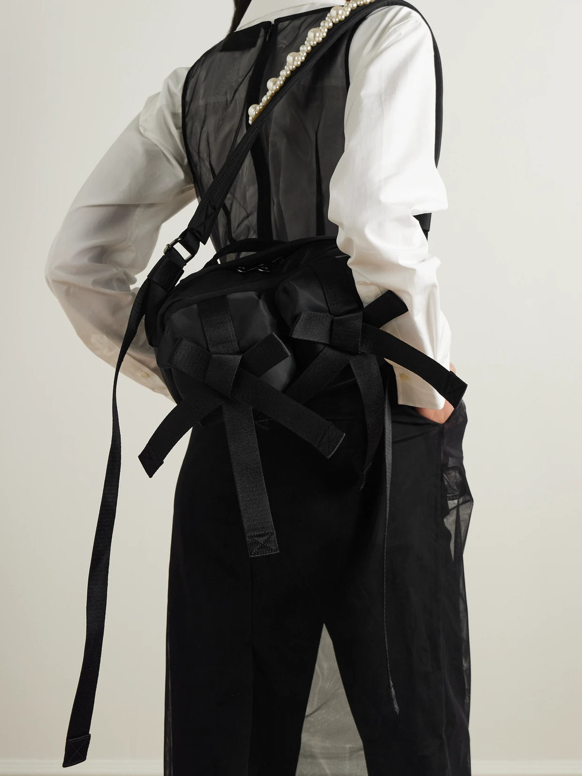 Image of Bags. Product name - Bow And Pearl-like Embellished Shell Belt Bag in Black colour by brand - Simone Rocha