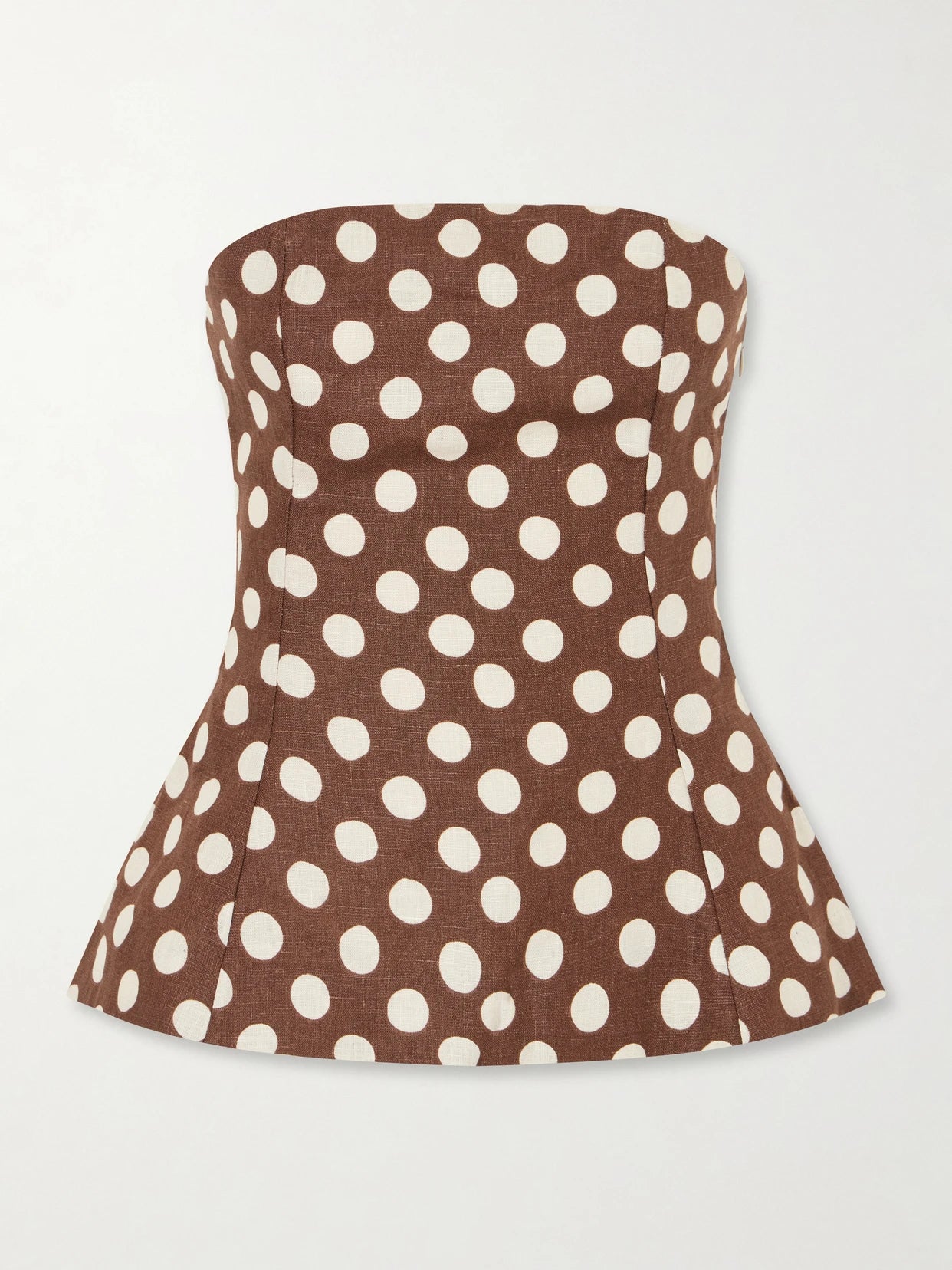 Image of a model wearing Tops. Product name - Petro Strapless Polka-dot Linen Top in Brown colour by brand - Faithfull