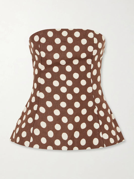 Image of a model wearing Tops. Product name - Petro Strapless Polka-dot Linen Top in Brown colour by brand - Faithfull
