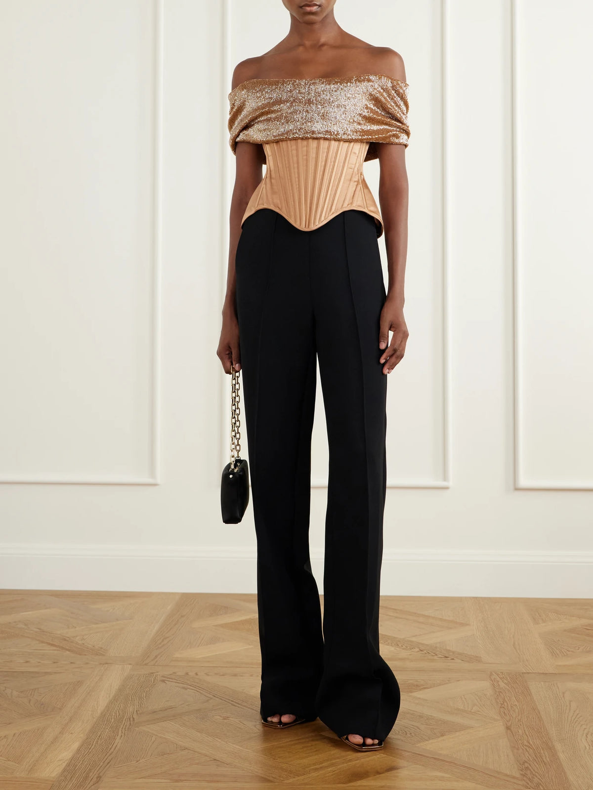 Image of a model wearing Tops. Product name - Wasp Corset Paneled Bead-embellished Silk Top in Brown colour by brand - Wiederhoeft